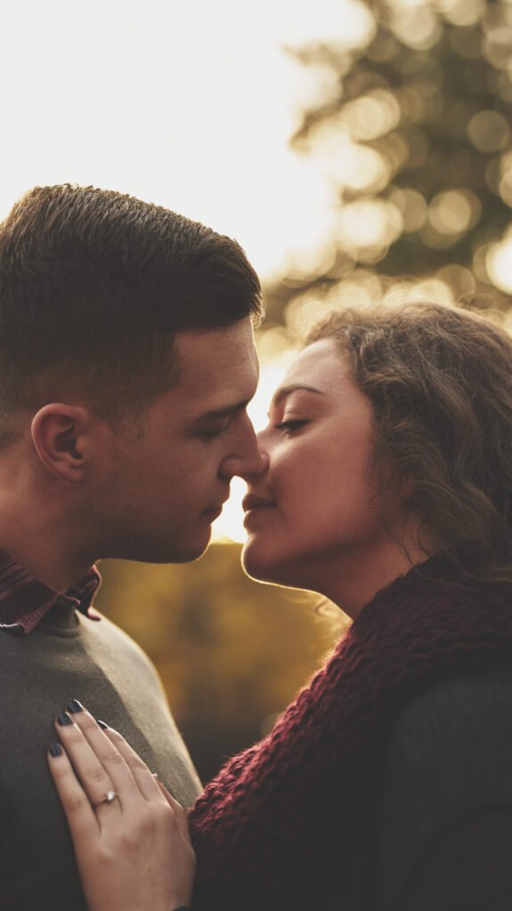 Image of a couple in a tender moment, about to kiss.