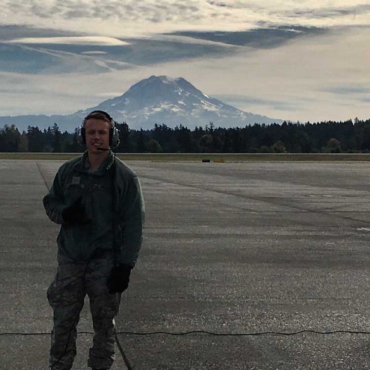 Image of Jake Chappell standing on an airfield, possibly in the Air Force