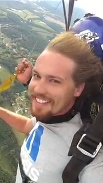 Image of Caleb Chappell skydiving, suspended in mid-air